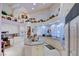 Well-equipped kitchen with ample counter space, modern appliances, and unique decorative shelving at 3008 Astoria Pines Cir, Las Vegas, NV 89107