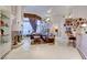 Elegant living room with a fireplace, comfortable seating, and decor shelves, ideal for relaxation at 3008 Astoria Pines Cir, Las Vegas, NV 89107