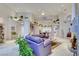 Spacious living room with high ceilings, neutral tones, and stylish decor shelves showcasing plants at 3008 Astoria Pines Cir, Las Vegas, NV 89107