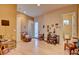 Comfortable living room featuring an armchair, light floors, and access to a patio area at 3008 Astoria Pines Cir, Las Vegas, NV 89107