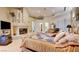 Spacious main bedroom with fireplace and sitting area at 3008 Astoria Pines Cir, Las Vegas, NV 89107
