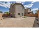 A gravel backyard with minimalist landscaping and a wall providing privacy to the property at 5589 Pico Ferrera Ct, Las Vegas, NV 89113