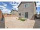 A gravel backyard with minimalist landscaping and a wall providing privacy to the property at 5589 Pico Ferrera Ct, Las Vegas, NV 89113