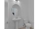 Bathroom with white fixtures, pedestal sink, and neutral tile flooring at 5589 Pico Ferrera Ct, Las Vegas, NV 89113