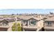 An elevated view of a neighborhood, showcasing the community's tidy roofs and desert city backdrop at 5589 Pico Ferrera Ct, Las Vegas, NV 89113