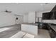 Open concept kitchen features granite counters, stainless appliances, and a large island at 5589 Pico Ferrera Ct, Las Vegas, NV 89113