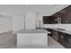 Kitchen view with a large island, stainless steel appliances, and granite countertops at 5589 Pico Ferrera Ct, Las Vegas, NV 89113