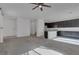Spacious living room with kitchen featuring a large island and modern appliances at 5589 Pico Ferrera Ct, Las Vegas, NV 89113