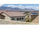 Sweeping mountain views and rooftop solar panels make this home a great choice at 5589 Pico Ferrera Ct, Las Vegas, NV 89113