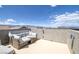 Cozy roof deck with comfortable wicker furniture and city views at 5589 Pico Ferrera Ct, Las Vegas, NV 89113