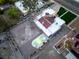 Captivating aerial perspective of the property with a pool, garden, and an ample parking area at 6861 E Washington Ave, Las Vegas, NV 89110