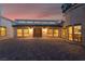 Expansive brick driveway leading to an inviting entrance with multiple windows for natural light at 6861 E Washington Ave, Las Vegas, NV 89110