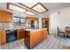 Traditional kitchen with tile floors, granite counters, stainless appliances, and a large island at 6861 E Washington Ave, Las Vegas, NV 89110