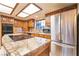 Kitchen displays an island, stainless steel appliances, granite countertops and wooden cabinets at 6861 E Washington Ave, Las Vegas, NV 89110