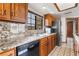 Kitchen showcasing a stainless steel refrigerator, granite countertops, and plenty of storage at 6861 E Washington Ave, Las Vegas, NV 89110
