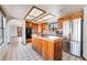 Well-equipped kitchen featuring stainless steel appliances, an island, and wood cabinetry at 6861 E Washington Ave, Las Vegas, NV 89110