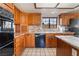 Full kitchen featuring granite countertops, a built-in oven, and stainless steel appliances at 6861 E Washington Ave, Las Vegas, NV 89110