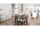 Cozy dining area with dark wood table and chairs in a bright, modern space at 8276 Aurora Peak Ave, Las Vegas, NV 89131