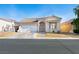 Charming single-story home with a well-maintained front yard and two-car garage at 8276 Aurora Peak Ave, Las Vegas, NV 89131