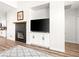 Modern fireplace and entertainment center featuring built-in cabinets and sleek design at 8276 Aurora Peak Ave, Las Vegas, NV 89131