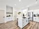 Open floor plan reveals gourmet kitchen with stainless appliances and island seating at 8276 Aurora Peak Ave, Las Vegas, NV 89131