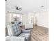 Bright living room with modern furniture, hardwood floors, and lots of natural light at 8276 Aurora Peak Ave, Las Vegas, NV 89131