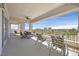 Relax on this spacious balcony, offering seating, a ceiling fan, and beautiful golf course views at 9213 Las Manaitas Ave # 401, Las Vegas, NV 89144
