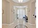 Elegant condo entryway with neutral colors, tiled floors, entry table, and an elevator at 9213 Las Manaitas Ave # 401, Las Vegas, NV 89144