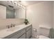 Well lit bathroom featuring a single sink vanity, large mirror, and standard toilet at 205 E Harmon Ave # 803, Las Vegas, NV 89169