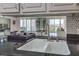 Kitchen sink and granite countertop open to a bright living space with a balcony at 205 E Harmon Ave # 803, Las Vegas, NV 89169