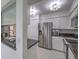 Modern kitchen featuring stainless steel appliances and sleek black countertops at 205 E Harmon Ave # 803, Las Vegas, NV 89169