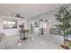 Stylish living area with tile floors, a dining table, and a mirrored wall offering depth and light at 205 E Harmon Ave # 803, Las Vegas, NV 89169