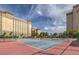 Community tennis courts at a condo community on a sunny day at 205 E Harmon Ave # 803, Las Vegas, NV 89169