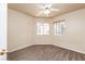 Carpeted bedroom with a ceiling fan and windows for natural light at 254 Reber Dr, Mesquite, NV 89027
