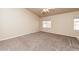 Bedroom featuring neutral carpeting, a ceiling fan, and bright, natural light at 254 Reber Dr, Mesquite, NV 89027