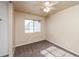 Cozy bedroom with neutral carpet, a ceiling fan, and a window providing natural light at 254 Reber Dr, Mesquite, NV 89027