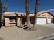 Inviting single-story home featuring a front yard with desert landscaping and a two-car garage at 254 Reber Dr, Mesquite, NV 89027