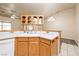 Bright kitchen features oak cabinetry, laminate countertops, and white appliances at 254 Reber Dr, Mesquite, NV 89027