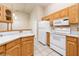 Kitchen with white appliances, oak cabinets, and laminate countertops at 254 Reber Dr, Mesquite, NV 89027