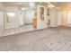 Open-concept living room showcasing neutral paint, plush carpet and natural light at 254 Reber Dr, Mesquite, NV 89027