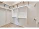 Spacious walk-in closet with custom shelving and ample storage for clothes and accessories at 3908 Specula Wing Dr, North Las Vegas, NV 89084