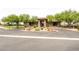 Exterior of the clubhouse with lush landscaping and roundabout at 3908 Specula Wing Dr, North Las Vegas, NV 89084