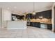Open kitchen with stainless steel appliances, granite countertops and backyard access at 3908 Specula Wing Dr, North Las Vegas, NV 89084