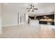 Spacious living room featuring an open concept with a kitchen and tile floors at 3908 Specula Wing Dr, North Las Vegas, NV 89084
