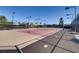 Well-maintained tennis courts with lighting, netting, and fencing for hours of competitive play at 3908 Specula Wing Dr, North Las Vegas, NV 89084
