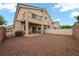 Spacious backyard with patio area and low-maintenance rock landscaping at 6045 Riverwalk Falls St # 102, North Las Vegas, NV 89031