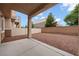 Backyard featuring a covered patio area and low-maintenance rock landscaping at 6045 Riverwalk Falls St # 102, North Las Vegas, NV 89031