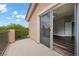 Charming balcony view into spacious main bedroom with hardwood floors at 6045 Riverwalk Falls St # 102, North Las Vegas, NV 89031