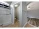 Modern bathroom with tiled shower and neutral color palette at 6045 Riverwalk Falls St # 102, North Las Vegas, NV 89031