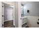 Stylish powder room with modern fixtures and elegant vanity at 6045 Riverwalk Falls St # 102, North Las Vegas, NV 89031